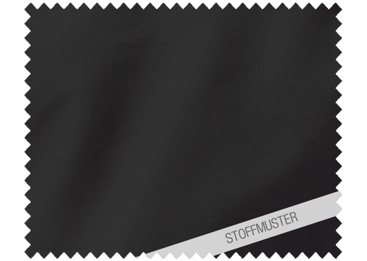 Hochwertiges Stoffmuster der Bettwäsche Corvo in elegantem Schwarz aus gewaschener Baumwolle, mit charakteristischer leichter Knitteroptik und butterweichem Griff. Perfekt für den lässig-modernen Schlafzimmer-Look. Stoffmuster, Hersteller: Stoffkontor.